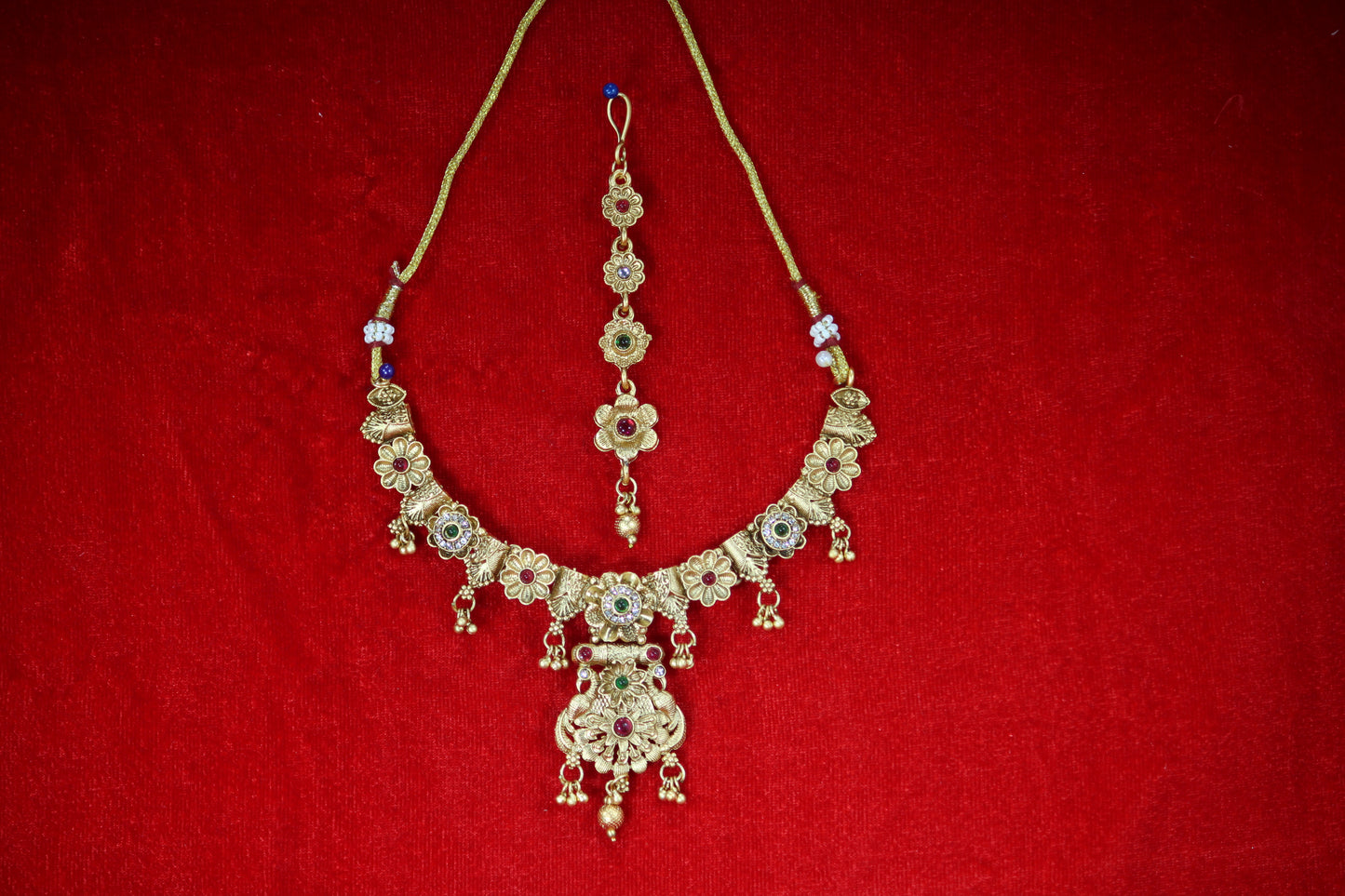 Gold Plated Floral Necklace and Maangtikka Set with Green and Red Stone Embellishments - Traditional Jewelry for Women