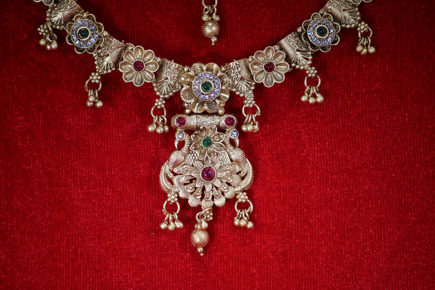 Gold Plated Floral Necklace and Maangtikka Set with Green and Red Stone Embellishments - Traditional Jewelry for Women