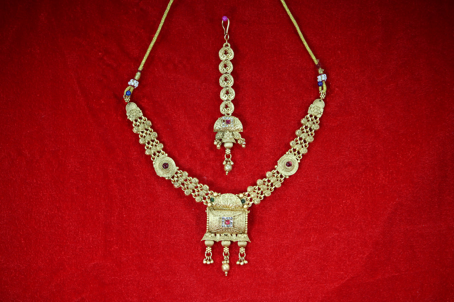 Gold Plated Necklace and Maangtikka Set with Green and Red Stone Embellishments - Traditional Jewelry for Women