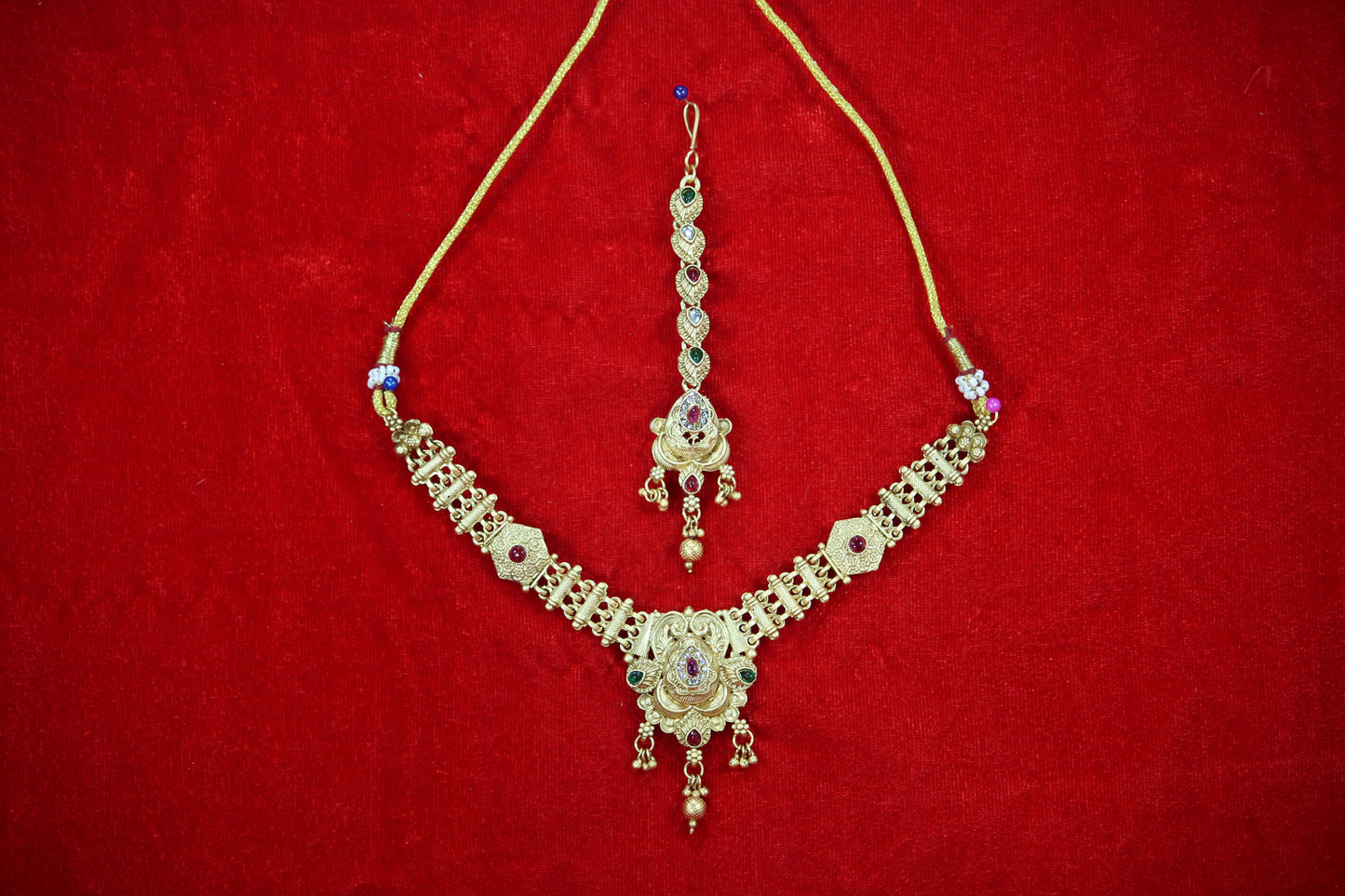 Gold Plated Droplet Necklace and Maangtikka Set with Green and Red Stone Embellishments - Traditional Jewelry for Women