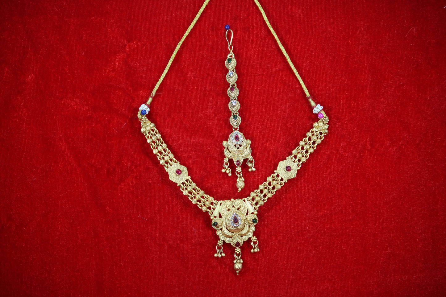 Gold Plated Floral Droplet Necklace and Maangtikka Set with Green and Red Stone Embellishments - Traditional Jewelry for Women