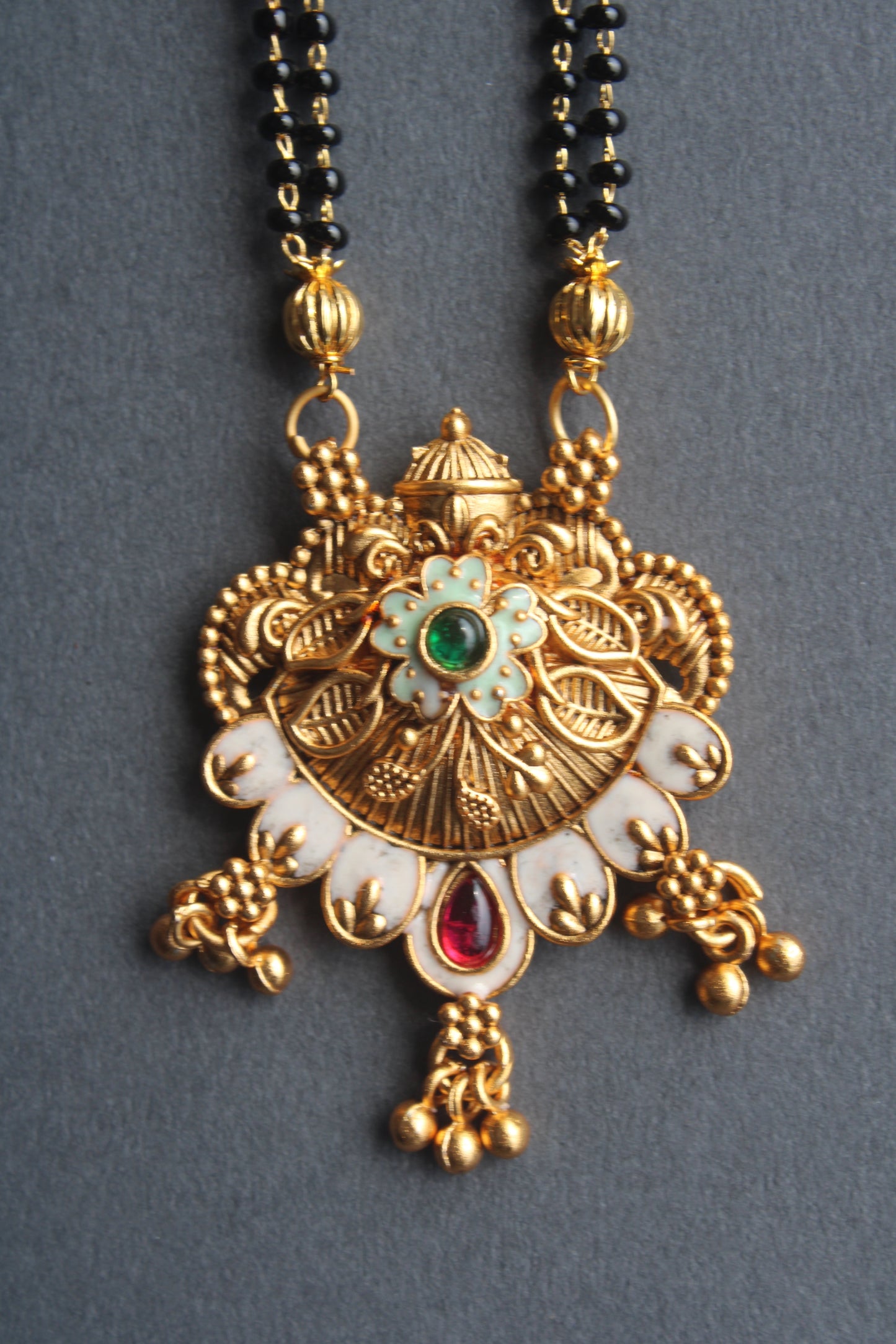 Trendy And Unique Floral Design Gold Plated Mangalsutra with Red Ruby & Green Emerald Accents- Traditional Indian Wedding Jewelry