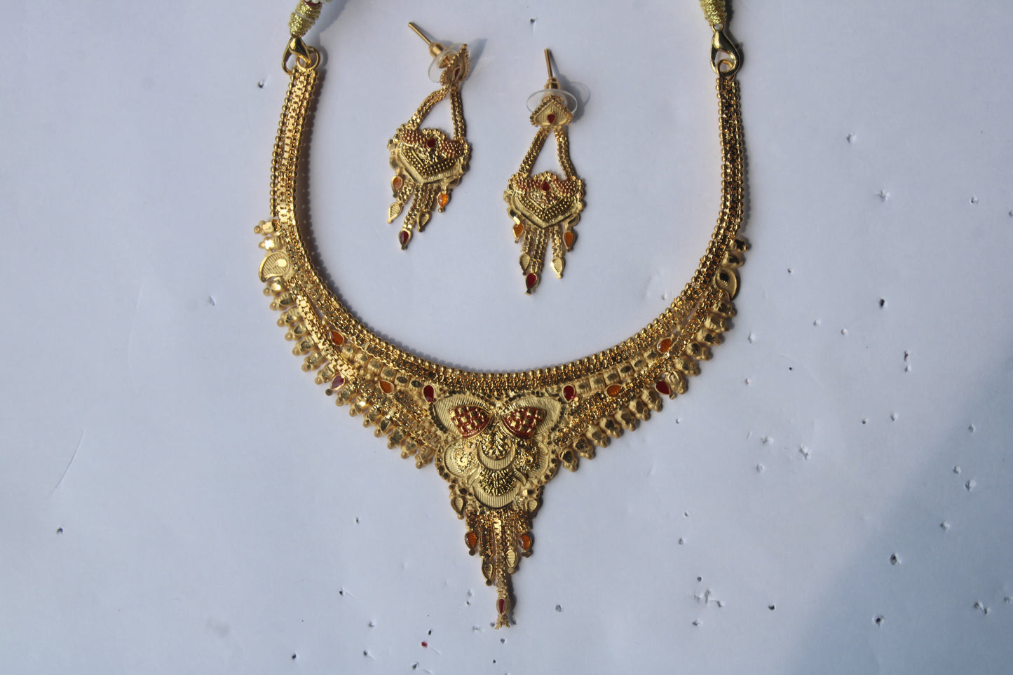 Unique And Trendy Gold-Toned Necklace with Intricate Red & Yellow Stone Accents – Perfect for Festive & Bridal Wear